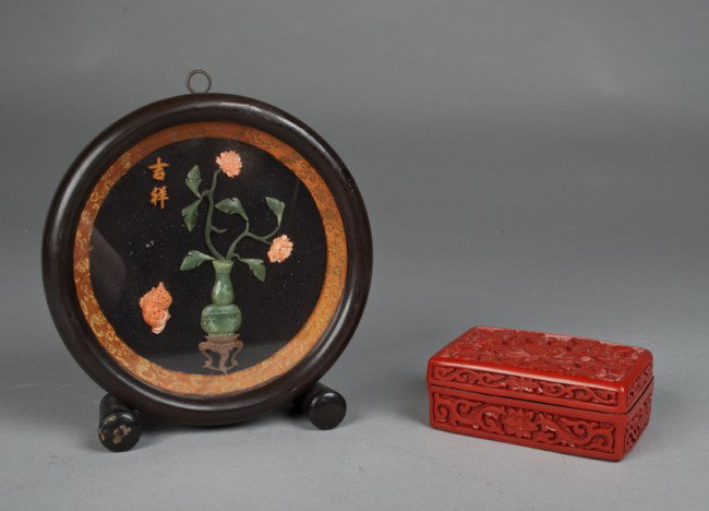 (2) Chinese Decorative Articles: To include a carved jade and coral plaque, finely carved to depict a urn of flowers and seashells, signed with two character mark, mounted in a hardwood shadowbox frame with silk brocade border, 7" H 