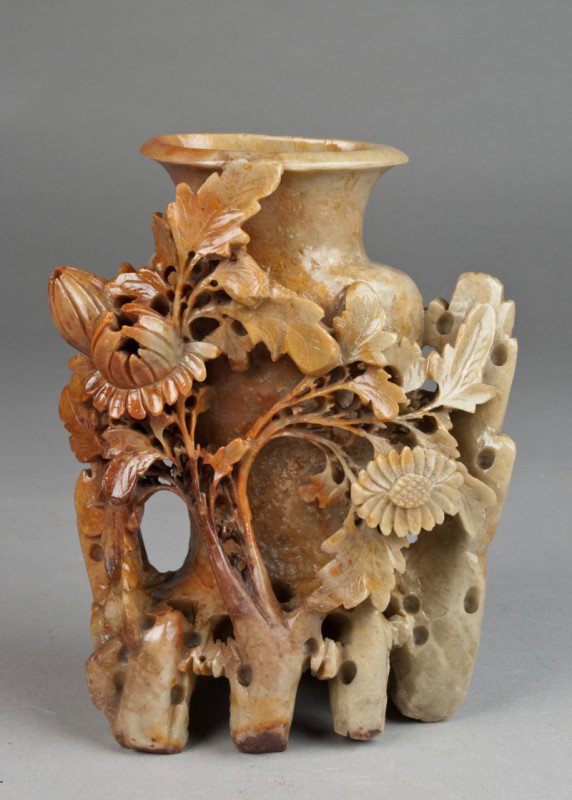 A Large and Impressive Soapstone Vase: Finely carved to depict an urn, the body carved with landscapes and floral. The urn engulfed with profuse foliage. 7.5" H x 9" W, circa early 20th century.