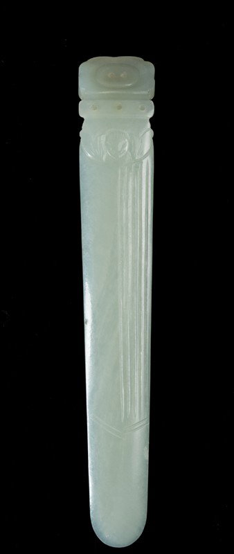 A Fine Chinese Carved Jade Hair Pin: Finley carved with a bat, and ruyi shaped top, the stone a light celadon tone with a fine polish, 4.375"L, circa early 20th century.