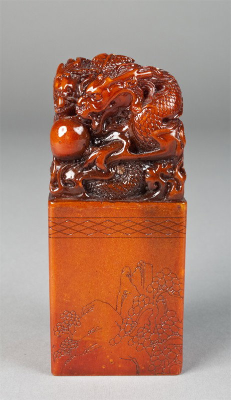 Finely Carved Chinese Soapstone Chop: Finely carved to depict two dragons attempting to obtain a pearl. Front with landscape carving, back with Chinese calligraphy carving. Seal on underside with three or four character stamp. 4.75" H, th