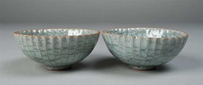Pr. Of Chinese Pottery Tea Cups: Scalloped edge with ribbing beginning to extend downward, in a green crackle glaze. 1 & 5/8" H x 3.75" Dia. 20th century.