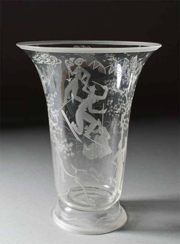 Very Fine S.A.L.I.R. Murano Engraved Skier Vase: By Guido Balsamo Stella (1886-1941), engraved by Fran Pelzel (1900-1941). Clear glass engraved to depict skiers with mountains, trees, snow clouds and snowflakes. 13" H x 10" Dia., signed S.A.L.I.R. e