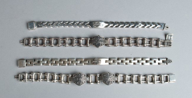 (4) Harley Davidson Sterling Bracelets: Includes a bike chain link with two logos, two bracelets with protruding logos in center, and a bike chain link with central logo. 7.5 ounces TW.