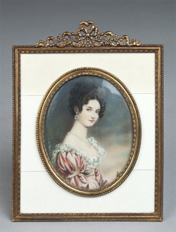 A Fine Miniature Portrait Painting on Ivory: Signed N. Rossi. Finely painted to depict a beautiful woman with ruffled dress wearing a triple strand pearl necklace and earrings. Mounted in an easel style brass and ivory clad frame. 3.75" H x 3" W