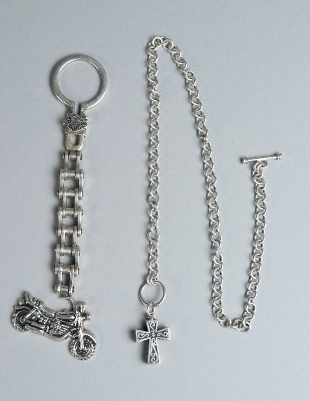 Harley Davidson Sterling Key Chain & Watch Fob: Includes a key chain with dangling motorcycle, in a chain link and logo at top, 6.5" L. Together with a watch fob of a crucifix box on chain, 17.25" L. 3.2 ounces TW.