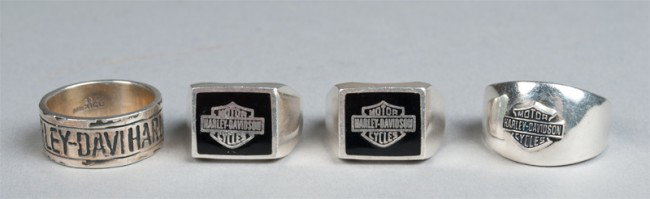 (4) Harley Davidson Sterling Men's Rings: Includes two rings with logo on flat portion, a ring with protruding logo, and a ring which spells out Harley Davidson. 2.2 ounces TW.