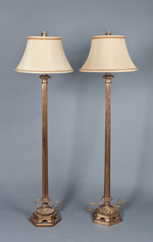 Pr. Of Ornamental Floor Lamps: Column and leaf form lamps on bases with tan and light brown cloth shades with leaf form finial. 62" H, very good condition with minor wear.