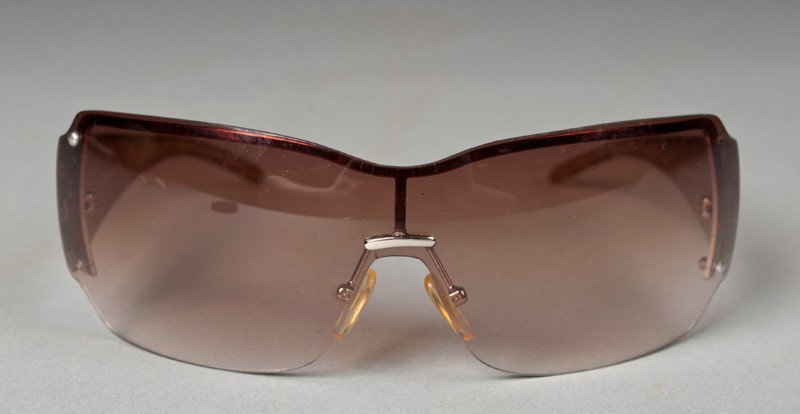Pr. Of Ladies "Bombshell" Gucci Sunglasses: In the Bombshell pattern, id # 5108-72bg. Good condition with wear to arms, lacking two screws.