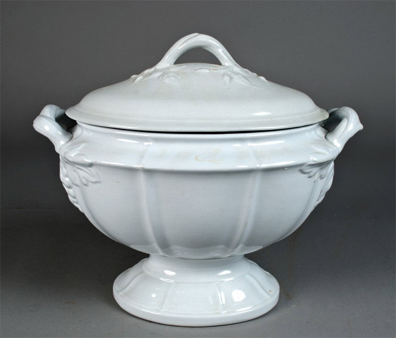 Large Ironstone China Covered Tureen: In the grape pattern (1845-1870), two handled tureen with grape and leaves and lid with vine. 12" H x 14" W, two old repairs to lid.