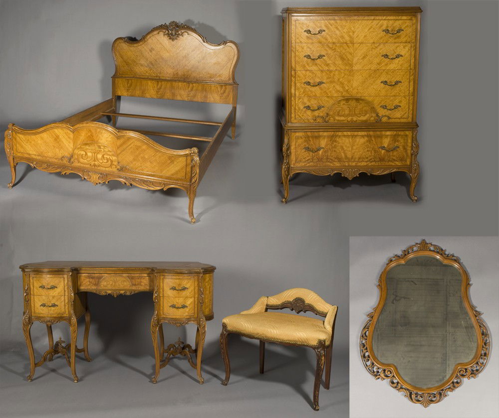 Five Piece French Provincial Bedroom Set: Set includes one tall chest of drawers with inlaid wood accents and scalloped apron, one vanity with inlaid wood accents and matching chair, mirror, full size headboard and footboard. All with carved