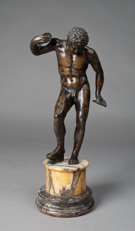 A Fine 17th Century Italian Bronze Statue: Finley cast to depict a figure of a cymbal player pumping a bellows with his right foot, mounted on marble socle, 11"H, not including the marble socle Italian or Venetian 17th century, condition overa