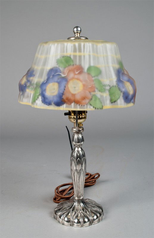 Antique Pairpoint Puffy Shade Boudoir Lamp: Reverse painted lamp in yellow banding with pink and purple flowers Base is style #C 3084 and signed on bottom. Measures 14.75" L, and has large crack through flowers 4.5" L.