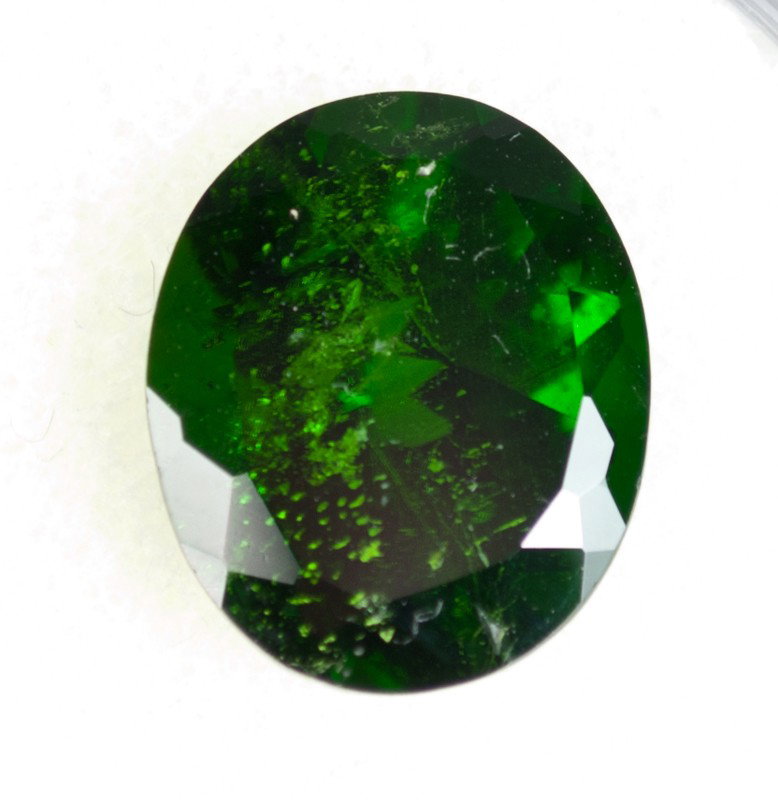 A Fine Oval Brilliant Cut Tsavorite Garnet: 4.76 Cts, clarity type 2: SI, Color description: sly-bG, Cut Grade: good, Tone: high, Saturation: high, Finish/Polish: Very good. With COA.
