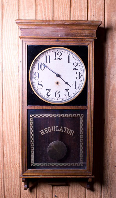 Sessions Clock Co. Regulator Wall Clock: Wood case with original glass with gold leaf stenciling. Dial marked with Made by the Session's Clock Co., Forestville, Conn. U.S.A. 38.5" H x 18" W x 5.5" D. With original key and in working conditio