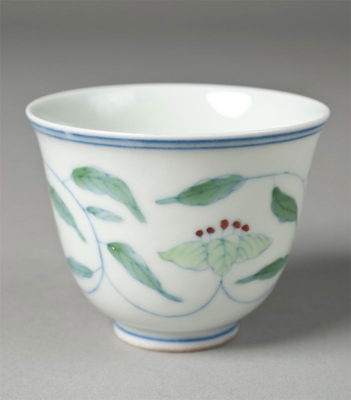 Chinese Porcelain Tea Cup: Decorated with green leaves, with six character mark within two squares in blue underglaze on underside. 2.25" H, circa 20th century.