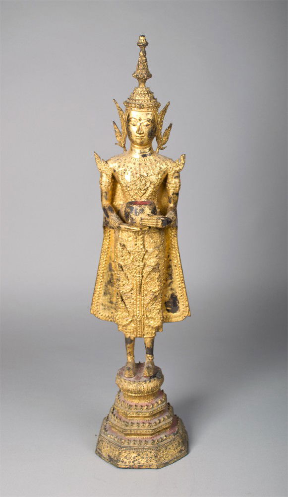 Thai Lilt Bronze Buddha: Standing with two hands holding a vase dressed in a long robe 27"H 19th-19th century.