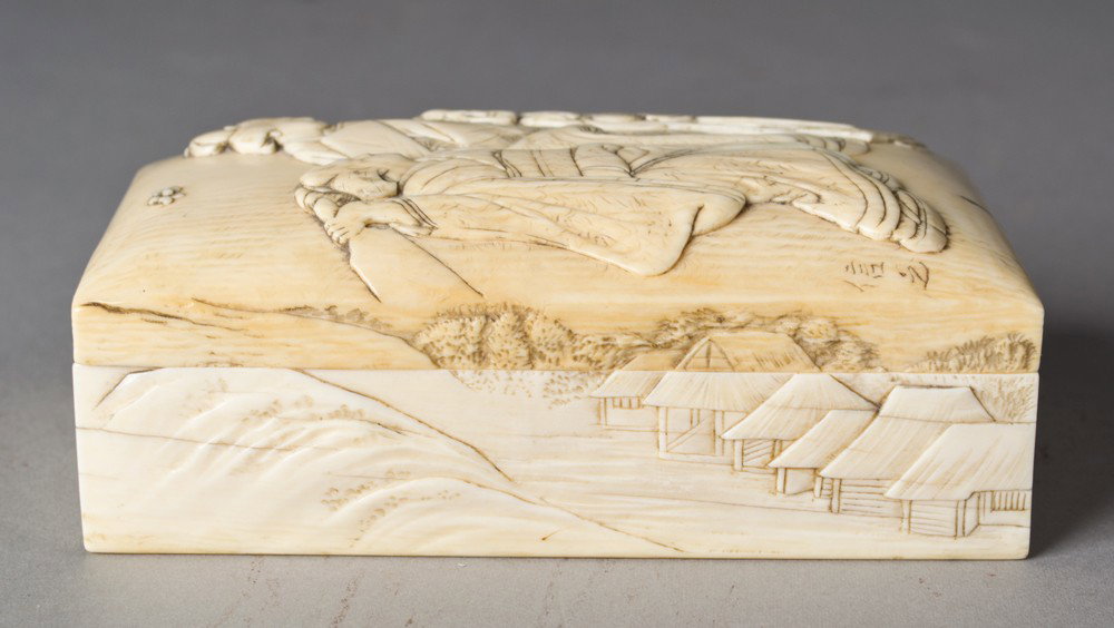 A Fine Chinese Carved Ivory Box & Cover: The lid finely carved to depict three beauties and a lotus blossom, the sides finely carved to depict landscapes and village scenes with figures the lid signed with two character mark, 4.5"L X 2.375"W