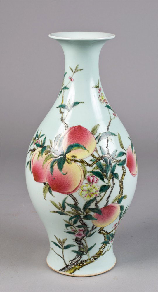Chinese Porcelain Vase Depicting Peaches: A Fine Chinese porcelain vase finely painted to depict peach tree in full blossom further decorated with bats in full flight the recessed base in six character mark in underglaze blue within two conce