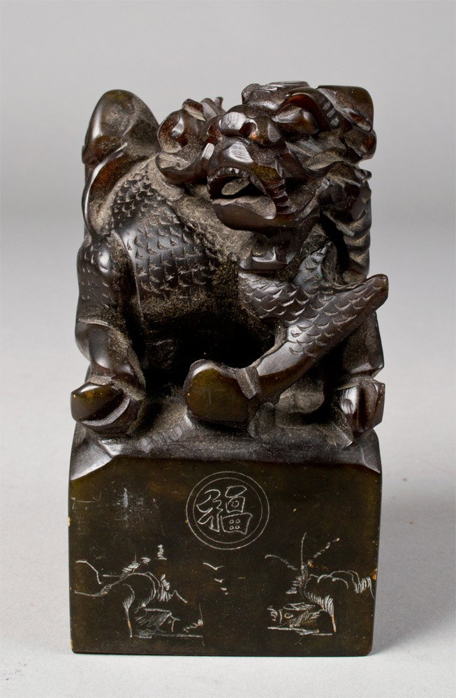 A Fine Chinese Carved Soapstone Seal: Finely carved at top to depict a dragon , and all four sides with geometric etchings and the seal with six character mark. 5.5" H x 2.5" Sq. Circa 20th century.