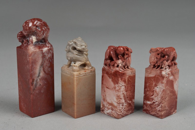 (4) Chinese Soapstone Seals: Finely carved to depict dragons and foo lions, the stone with a fine polish. Tallest 3.875" H, circa early 20th century.
