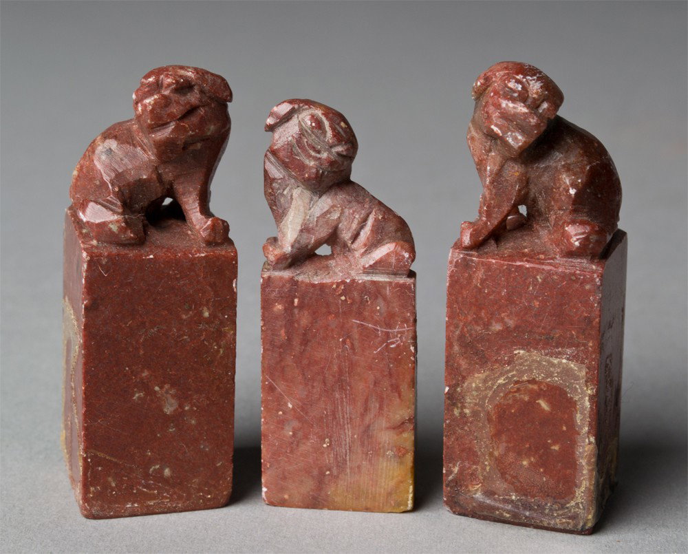 (3) Chinese Carved Soapstone Seals: All carved to depict foo dogs al three chops carved with various characters tallest is 2.125"H, circa early 20th century.