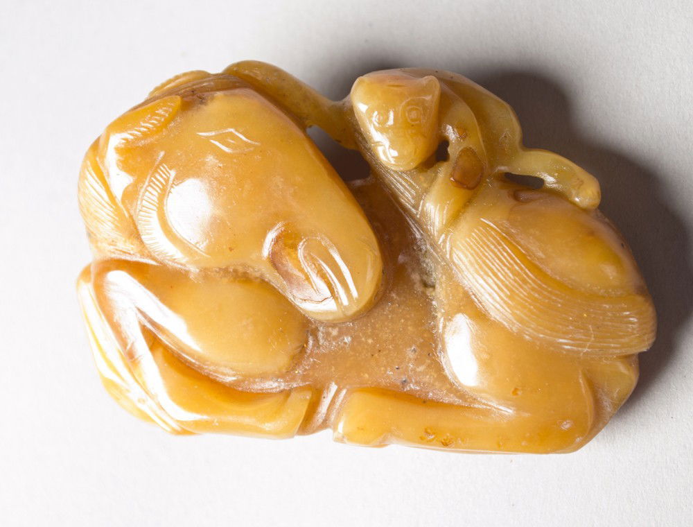 Chinese Shoushan Stone Buckle: Finely carved to depict a horse and monkey the stone a deep yellow with fine polish, .5"L X 1.75"W circa late 19th century.