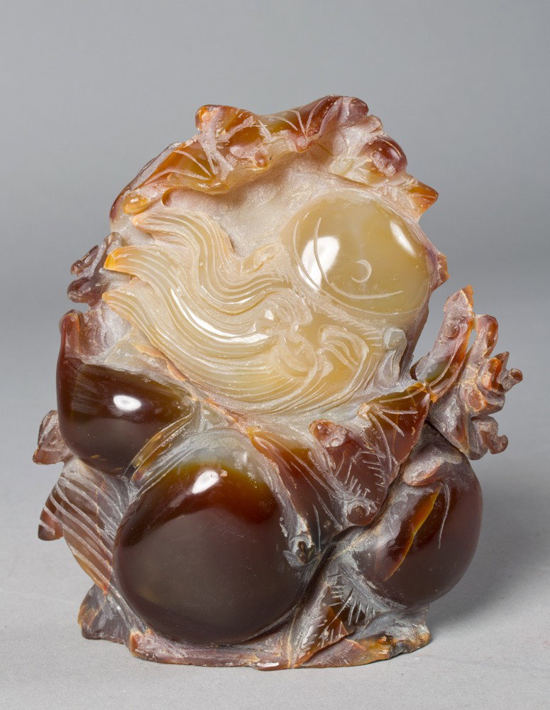 A Fine Chinese Agate Carving of an Elder: Finely carved to depict an elder with bats above and below with double gourd and the reverse with carved flower, 5.25"H X 4.25"W, circa 20th century.