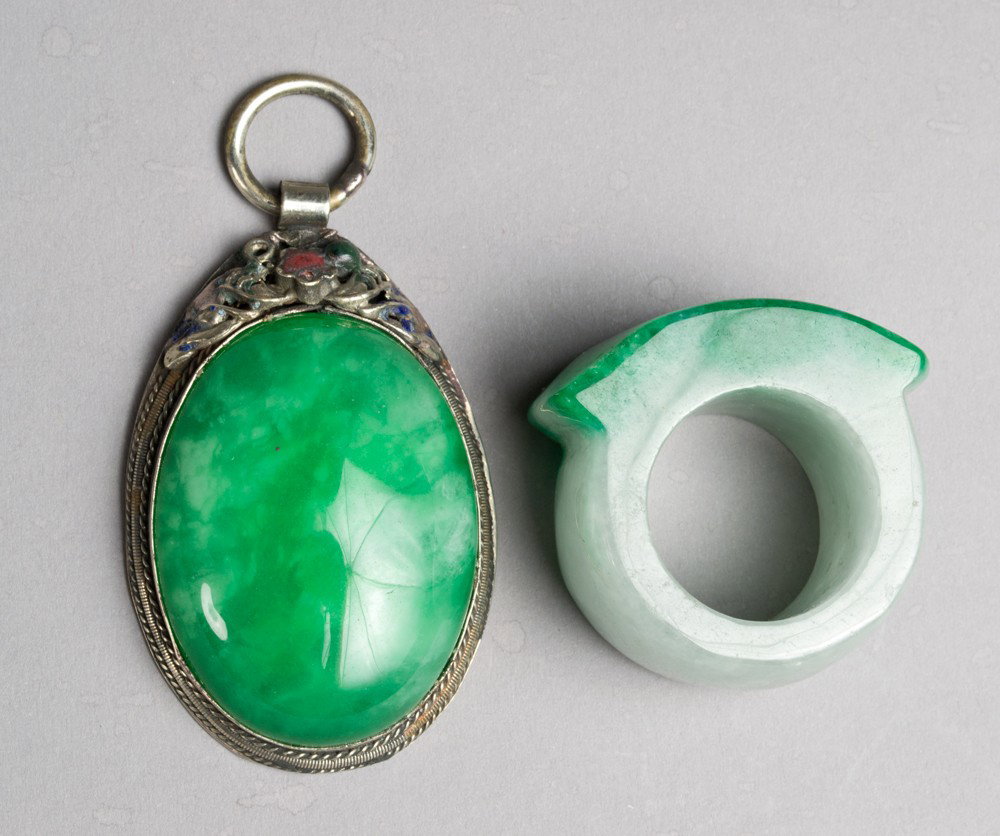 (2) Chinese Jade Pendant & Archers Ring: Includes a oval pendant mounted in silver and enamel, together with a archers ring. Largest 1.5" L, circa 20th century.