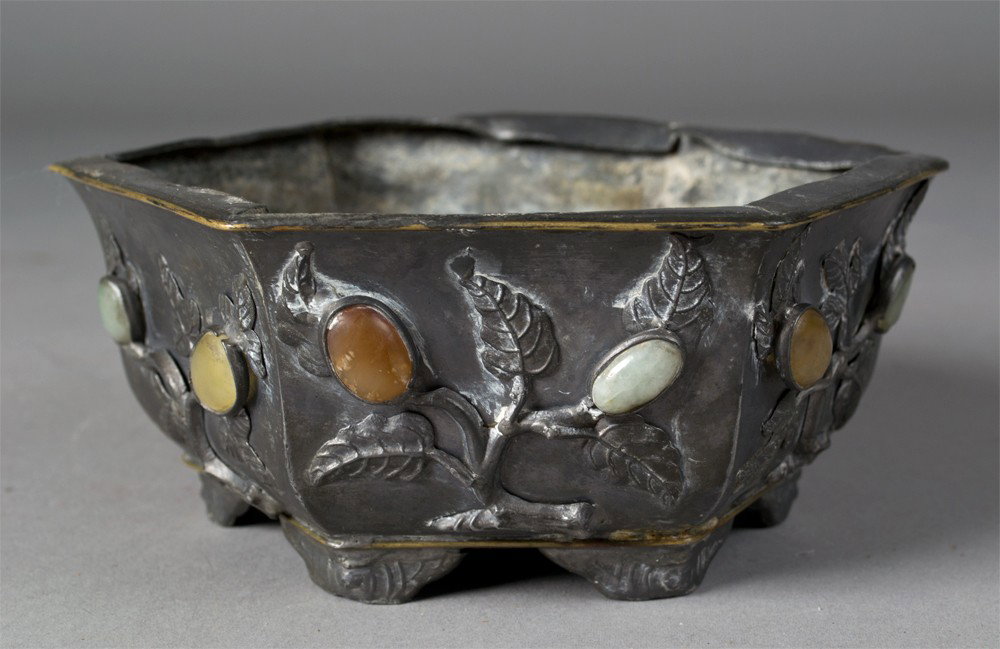Chinese Jade Inlaid Tin Flower Frog: The eight sided pot with raised lotus plants with six ruyi inlaid with jade, amethyst, and agate, 5.75"W X 2.5"H circa late 19th/early20th century.
