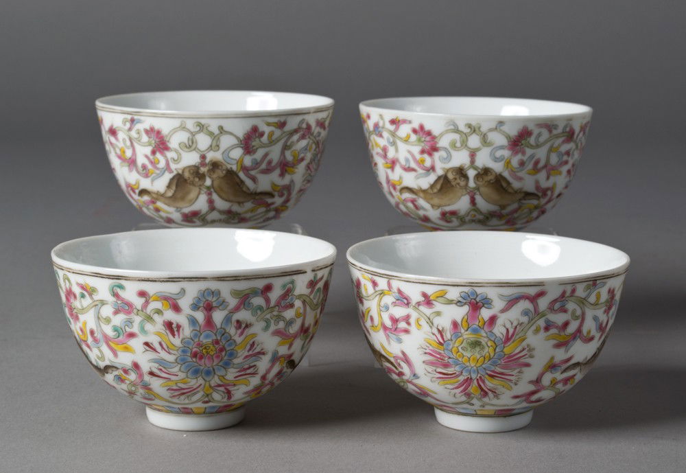 (4) Chinese Famille Rose Tea Cups: Finely enameled to depict fish within floral and scrolling designs, each with six character mark in iron red, 2"H in custom fitted box circa 20th century.