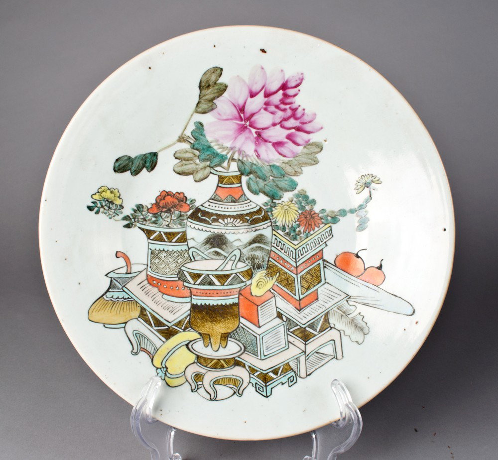 Chinese Famille Rose Porcelain Basin: Finely painted to depict vases and precious object the exterior rim with bats, the foot rim with seal mark in iron red within a double square, 11.5"D X 1.5"H, circa 19th century.