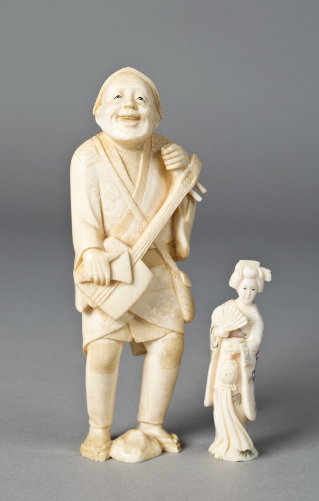 (2) Carved Ivory Figures: To include a ivory musician playing a banjo signature to base 5.375"H together with an ivory netsuke finely carved to depict a beauty with inked highlights 2.75"H, circa early 20th century.