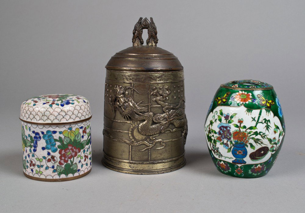 (3) Pcs. Chinese Cloisonné and Metal Ware: To include a Chinese cloisonne jar china mark to base an enamel decorated drum for jar decorated with flowers and vases and a bronze bell form covered container decorated to depict dragons, largest is