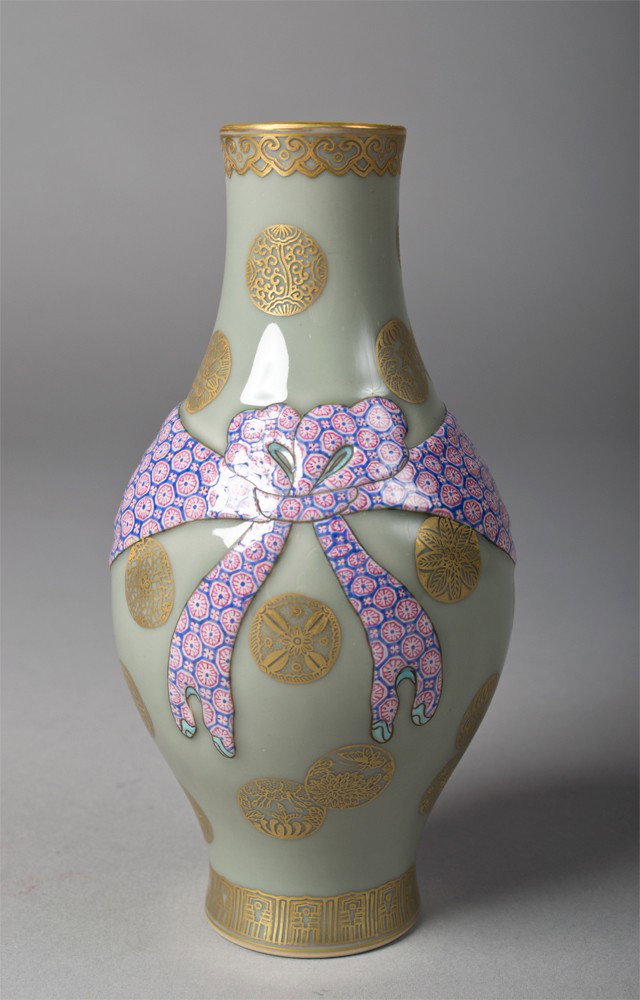 Chinese Famille Rose and Celadon Porcelain Vase: Having an olive shape with applied ribbon in Famille rose enamel having seal mark of Great Qing Qianlong production in underglaze blue 6.75"H circa early 20th century.