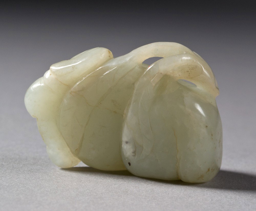 Chinese Qing Carved Pebble Jade Toggle: Finely carved to depict peaches and bats. 2.25" x 1.75", circa 19th century.
