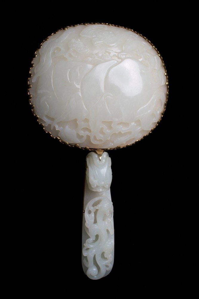 Chinese Qing Jade & Gold Mounted Mirror: A spectacular and large Chinese Qing carved and jade gold mounted mirror, the plaque finely carved to depict peaches and bats, the buckle finely carved to depict a dragon. Mounted in a gold tested 18K