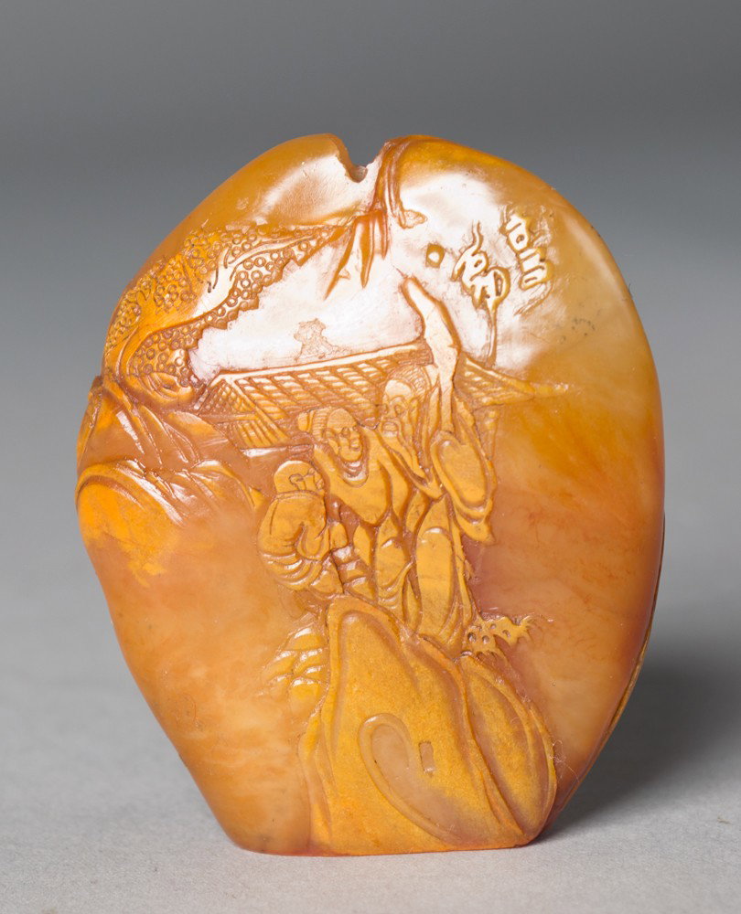 A Fine Chinese Shoushan Snuff Bottle: Carved as a seal the front and back finely carved to depict figures in a landscape the stone with a fine polish very unusual, 2.375"H circa late 19th-early 20th century.