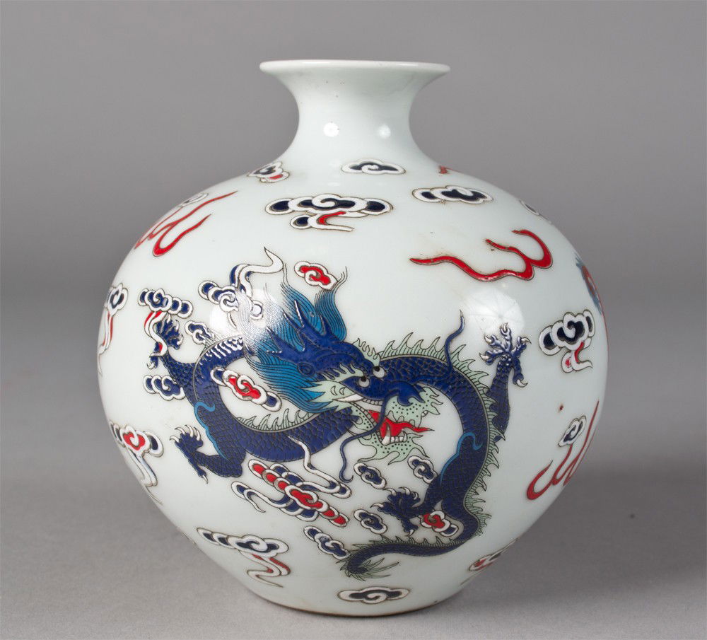 Chinese Famille Rose Porcelain Vase: Finely enameled to depict five clawed dragons chasing a flaming pearl amid ruyi with six character mark of the Great Qing Qianlong Production in underglaze blue, 4.75"H X 4.5"W in custom fitted box ci