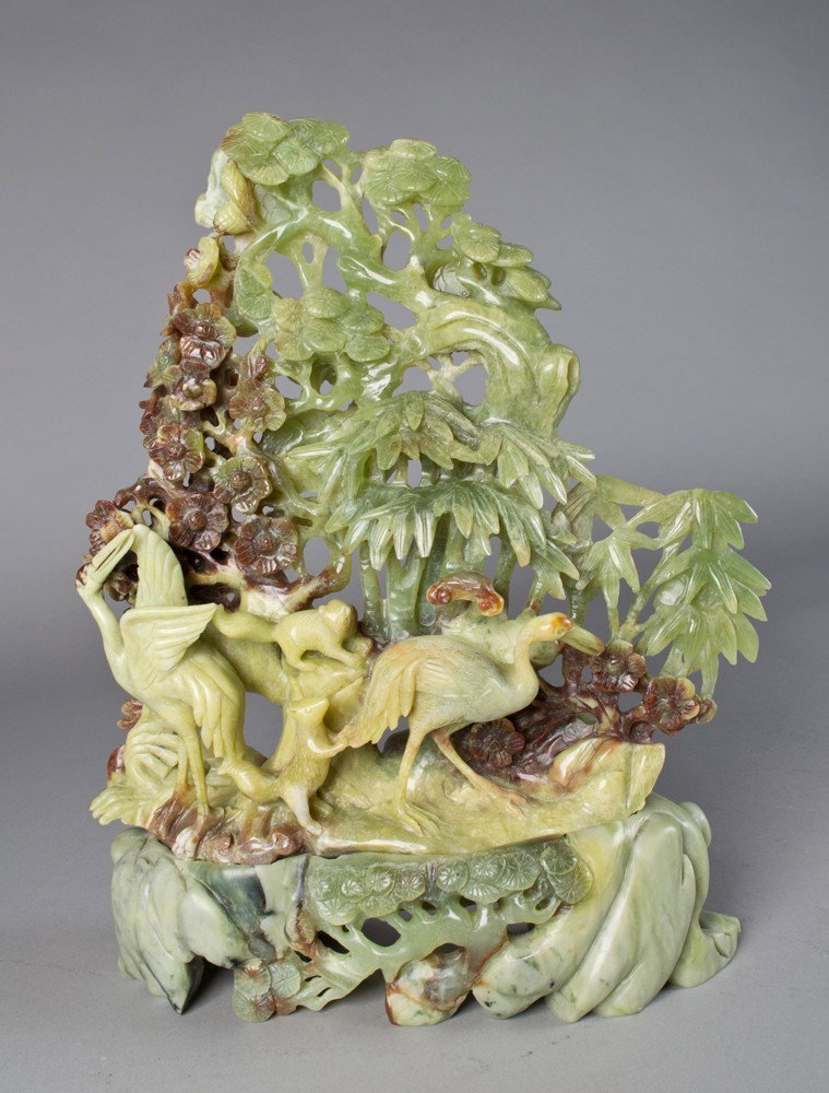 Chinese Jade Carving of Squirrels and Cranes: Finely carved to depict cranes and squirrels amongst bamboo and blossom trees, the jade base to depict lingzi, 15.5"H X 12"W including the base circa 20th century.