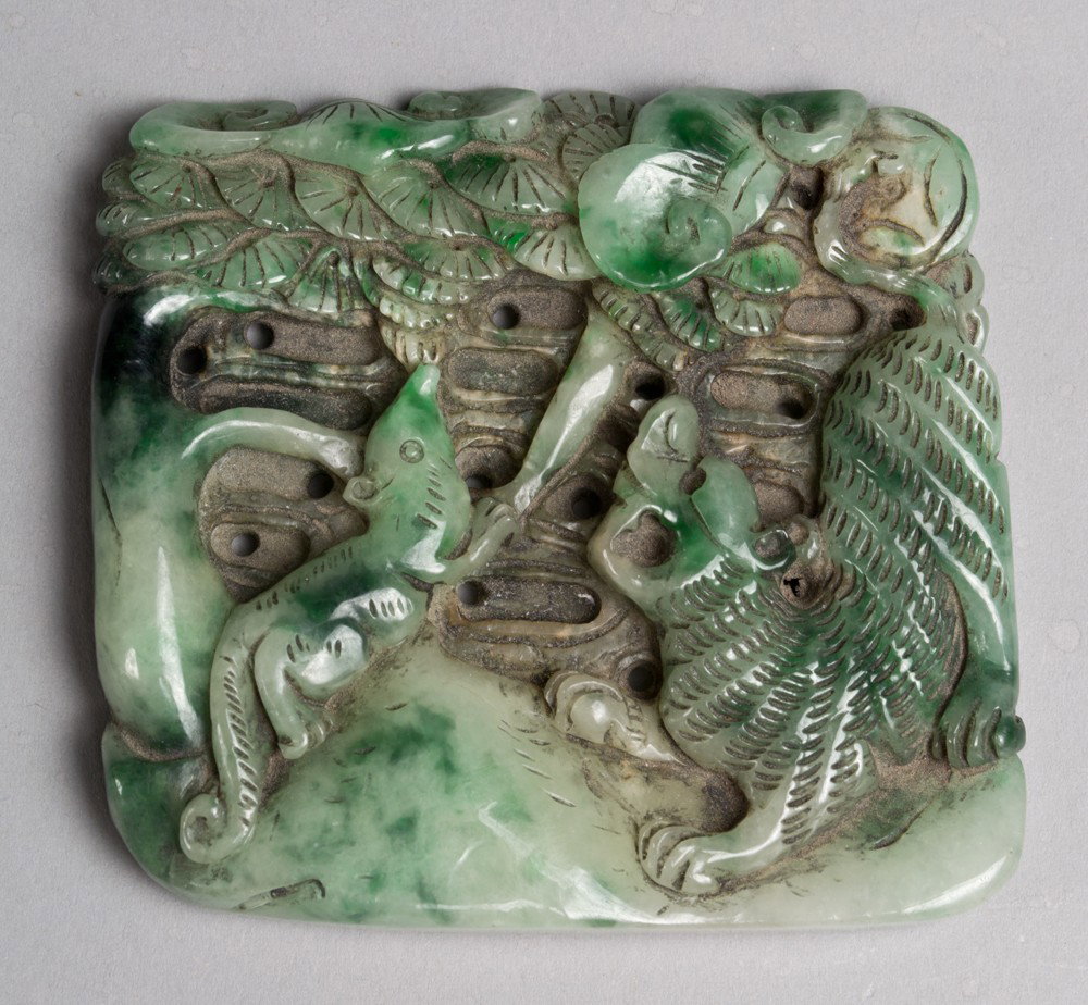 A Fine Chinese Carved Jade Plaque: Finely carved to depict two animals eating from a tree.3" W x 3.25" H, circa 20th century.