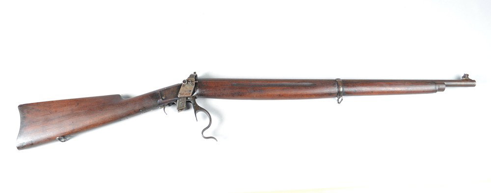 Winchester Model 1885 Winder Musket: Serial #125534, Cal. 22 short, 28" barrel, factory swivel sling mounts, Lyman adjustable rear peep sight with fold down front elevation sight, saddle ring butt plate. Condition: wood retains an old nu
