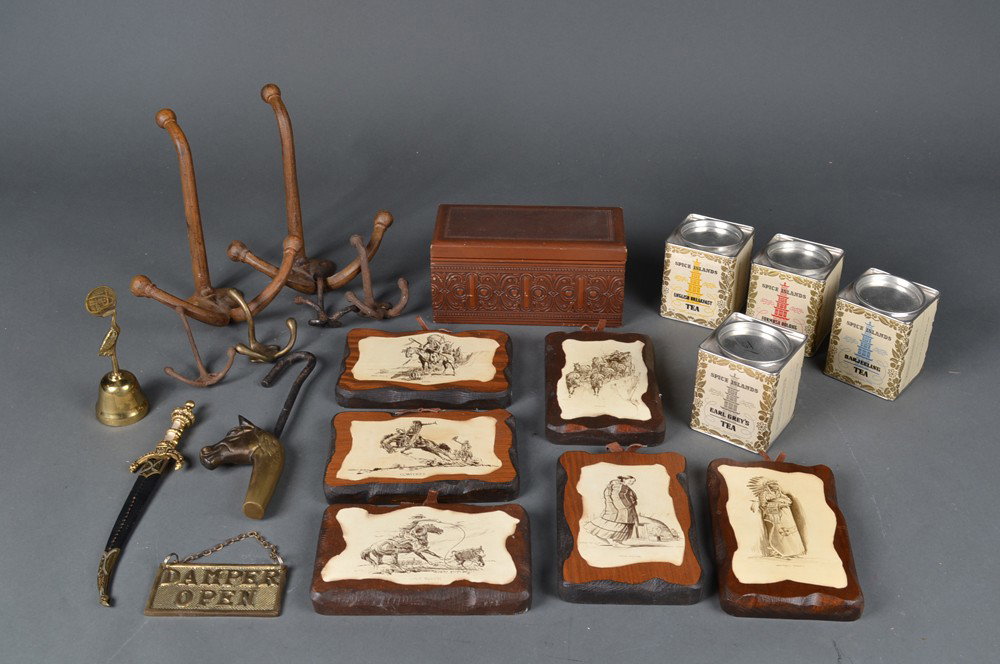 Collector's Lot of Decorative Articles: Includes six wood plaques depicting Native Americans, four tea tins, a sword form letter opener, a brass bell, six iron and brass hooks, a brass horse head pendulum, a brass "Damper Open, Damper Close