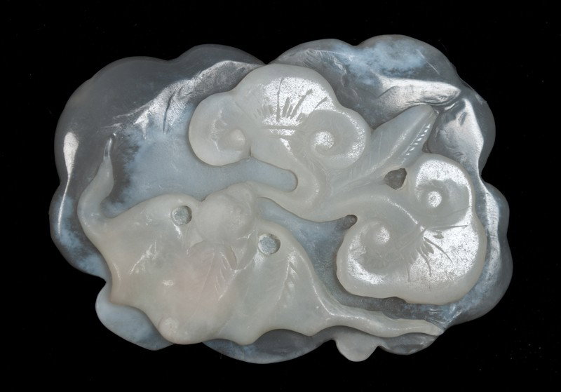 Chinese Carved Jade Bats: Finely carved on both sides, with one side depicting a bat and flowers, and other side depicting ruyi. 2.75" L, circa 20th century.