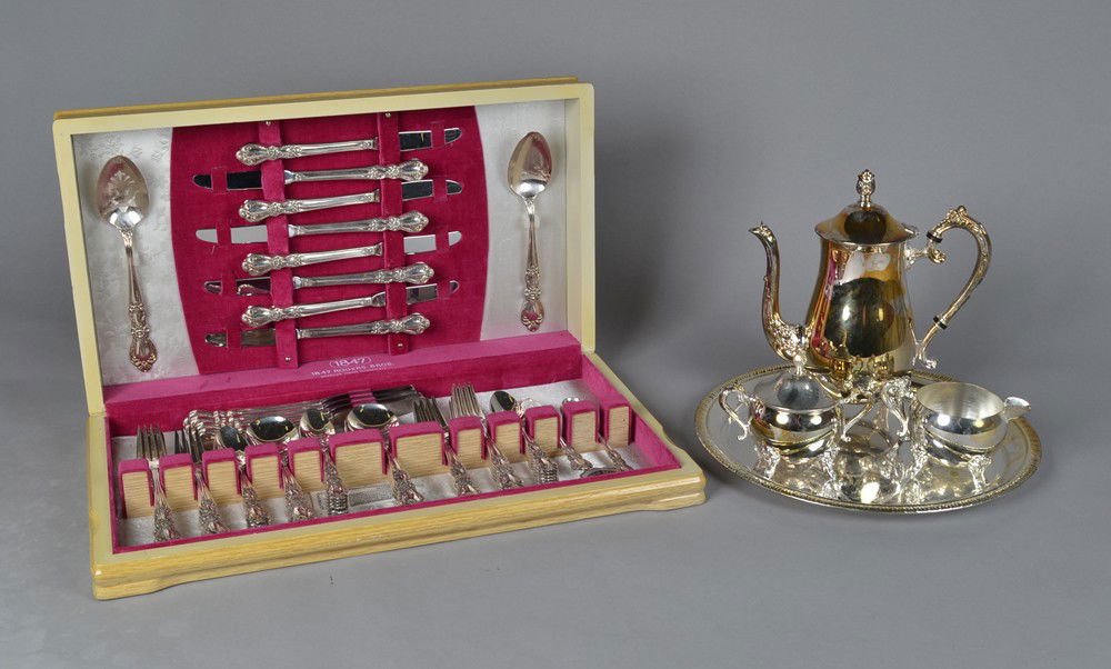 (80) Rogers Bros. Silver Plated Flatware & Tea Set: Includes a 76 piece Rogers Bros. Flatware set in the Heritage pattern, to include 12 butter knives, 12 dinner forks, 12 salad forks, 24 tea spoons, 12 soup spoons, master butter knife, two serving spo