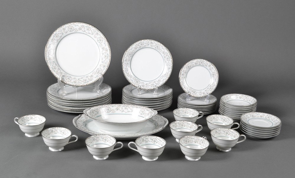 (49) Piece Noritake "Oxford" Pattern: In the "Oxford" pattern with blue floral designs and silver banding. Includes 8 dinner plates, 8 salad plates, 8 finger bowls, 8 b & b plates, 6 saucers, 9 coffee cups, 1 platter and 1 oval server. Go