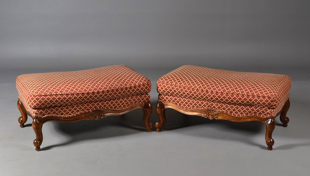 Pr. Of Thomasville® Ottomans: In red and gold diamond pattern fabric, each on four wood scroll feet. 16" H x 35" W x 23" D. Circa 20th century.