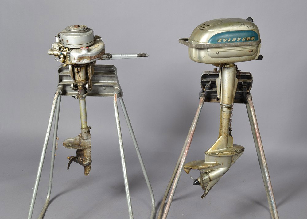 (2) Evinrude And Johnson Boat Motors And Stand: To include one Evinrude sportsman #4425-072790 along with a Johnson Motors seahorse serial #386927. Largest measures 44" H with stand. Have not been tested