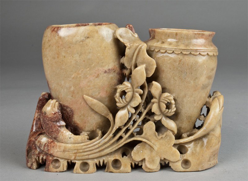 Chinese Carved Soapstone Double Vase Grouping: Finely carved to depict two conjoined vases with fish and foliage, the stone a light tan with russet inclusions. 7" W x 5" H, circa early 20th century.