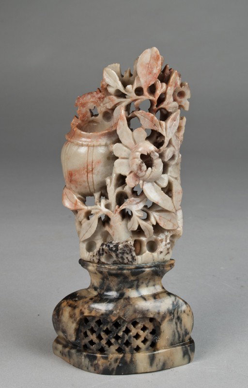 Chinese Carved Soapstone Grouping: Finely carved to depict a basket with flowers on an urn shaped stand. 7.25" H, early 20th century.