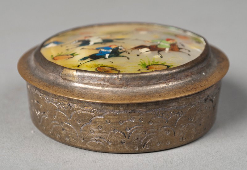 A Fine Persian Hand Painted Inlaid MOP Snuff Box: Metal circular box painted brass, with lid inlaid with Mother-of-Pearl and finely painted to depict figures on horses playing polo. 2.5" Dia., wear to finish. Circa early 20th century.